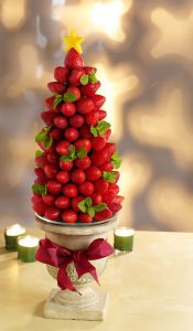 Small Red Berries Christmas Tree in a Cup With Yellow Star on Top