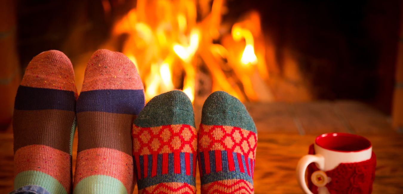 couple with socks having a Quiet Christmas date Indoors