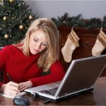 Woman Writes Christmas Preparation List