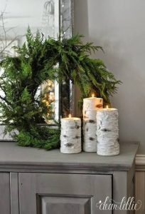 Birchwood candles infront of green wreath