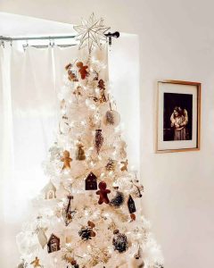 white Сhristmas tree with neutral back ornaments