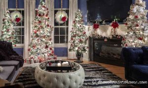 4 White, Red, and Gold Christmas Trees in Living Room