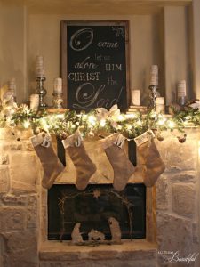 natural Christmas stockings on fireplace