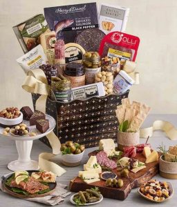 Christmas gift basket with nuts, crackers, cheese and meat